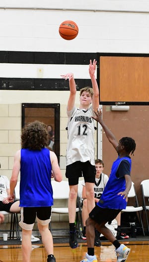Lutheran Westland's Christian Fontaine shoots during a Lutheran Westland Summer League boys basketball game against Garden City on Tuesday, July 26, 2022.