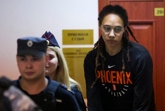 WNBA star and two-time Olympic gold medalist Brittney Griner is escorted to a courtroom for a hearing, in Khimki just outside Moscow on Wednesday.