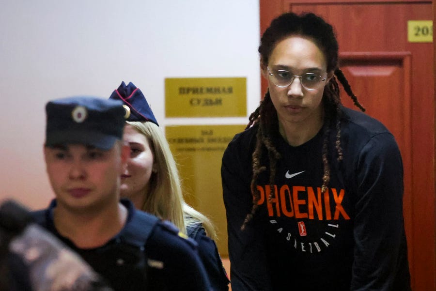 WNBA star and two-time Olympic gold medalist Brittney Griner is escorted to a courtroom for a hearing, in Khimki just outside Moscow, Russia, on July 27, 2022.