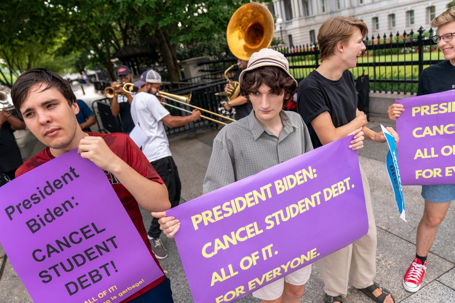 Too Much Talent Band performs during a rally to urge President Joe Biden to cancel student debt near the White House in Washington D.C.,  Wednesday, July 27, 2022.
