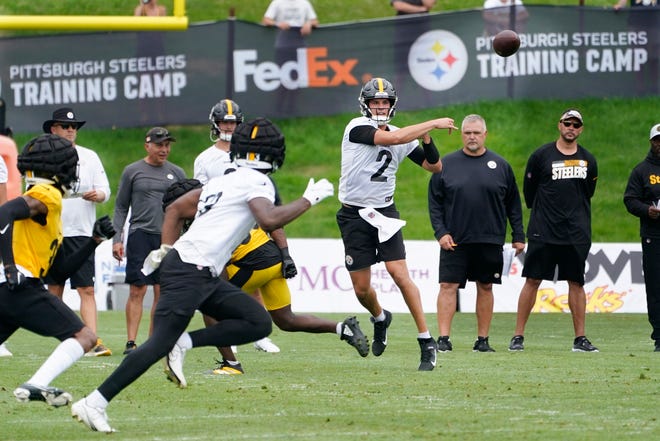 Pittsburgh Steelers quarterback Mason Rudolph (2) , right, throws a pass during the NFL football team's training camp in Latrobe, Pa., Wednesday, July 27, 2022. (AP Photo/Keith Srakocic)