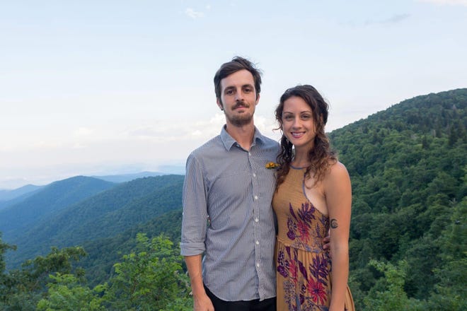 Amber and Josh Niven pose for a photo in Pisgah National Forest. The couple will celebrate the release of their new book, "Discovering the Appalachian Trail: A Guide to the Trail's Greatest Hikes" on Aug. 13 at Big Pillow Brewing in Hot Springs.