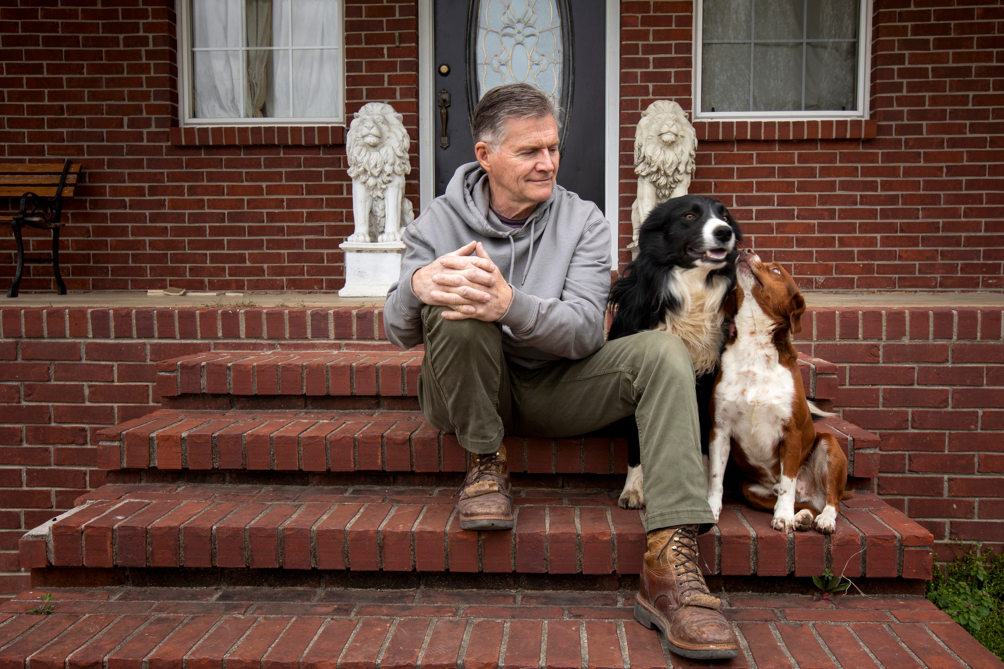 Mark McAlister sits outside his home with his dogs on Friday, March 25, 2022, in Greenfield, Tenn. He reflects on how much has happened in the last six years since being released from prison in Yemen. "From that point on, from October 20, 2015, just our lives had changed. It made my children grow up a lot."