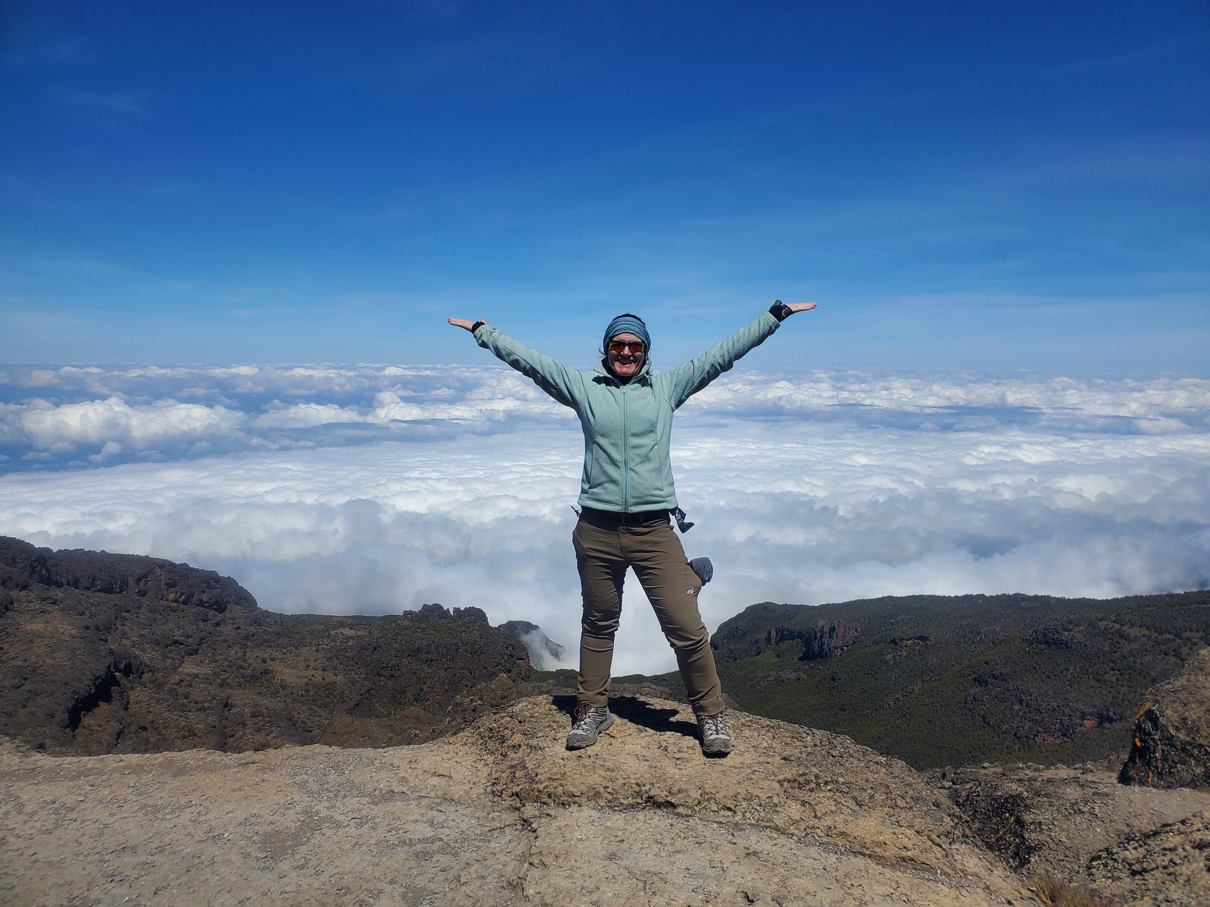 Christin Lipinski stands on Mount Kilimanjaro.