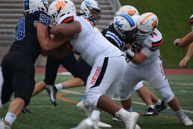 Danny Pham blocks a pass rusher in a game versus ETHS reading. August 28, 2021.