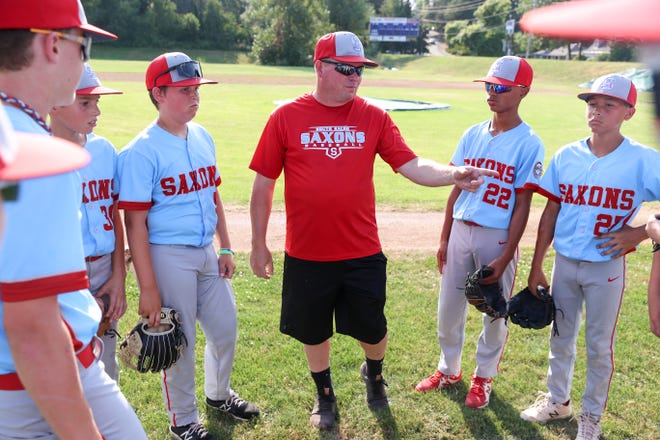 Coach Mike Sidwell talks to players during practice at Gilmore Field City Park.