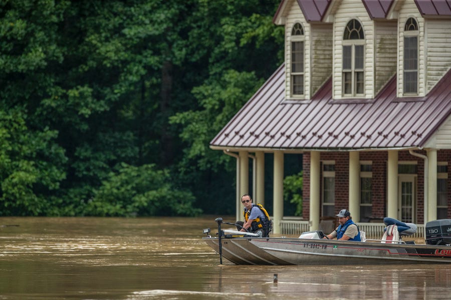 Homes are flooded by Lost Creek, Ky., on Thursday, July 28, 2022.  Heavy rains have caused flash flooding and mudslides as storms pound parts of central Appalachia. Kentucky Gov. Andy Beshear says it's some of the worst flooding in state history.