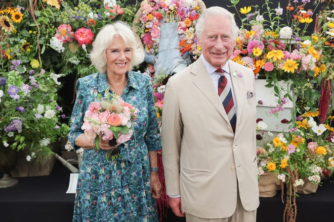 Prince Charles and Duchess Camilla of Cornwall pose at The Sandringham Flower Show 2022 at Sandringham on July 27, 2022, in King's Lynn, England.