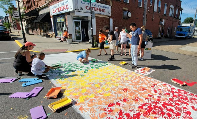 Ambridge community painting crosswalks as part of Heart & Soul project