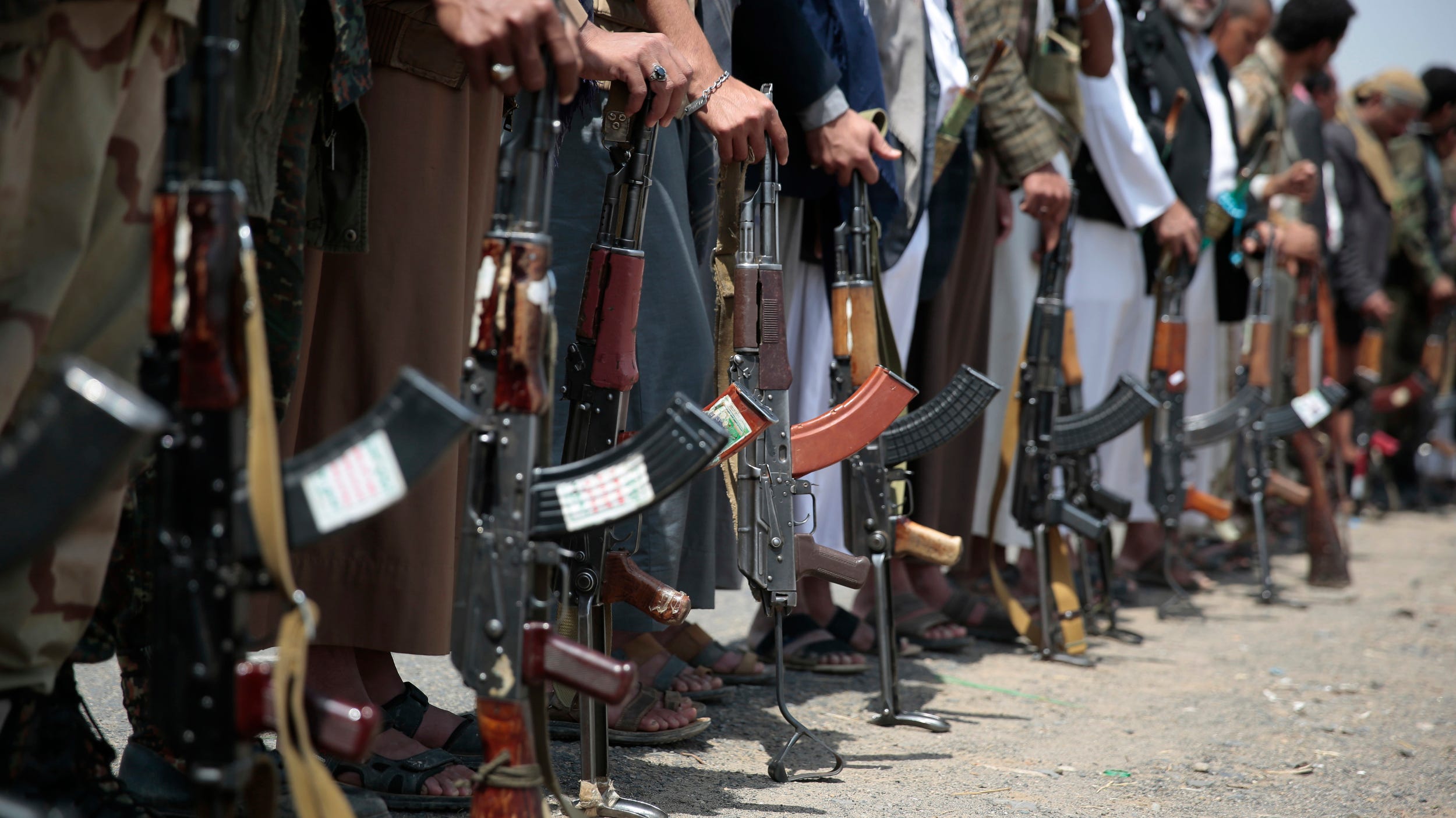 Tribesmen loyal to Houthi rebels hold their weapons during a gathering aimed at mobilizing more fighters into battlefronts in several Yemeni cities, in Sanaa, Yemen, Thursday, Aug. 11, 2016.