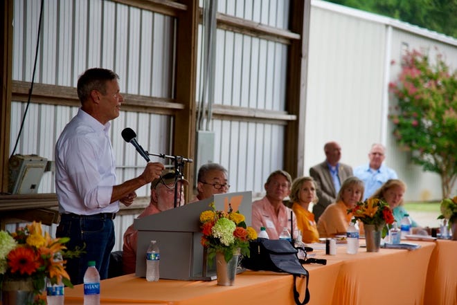 Tennessee Governor Bill Lee (far left) speaks as (from left to right) Blake Brown, Dr. Hongwei Xin (Dean of AgResearch),  Randy Boyd (president of the University of Tennessee system), Carrie Castille, Donde Plowman (Chancellor of UT Knoxville) listen on at the 32nd annual "Milan No-Till" Field Day.