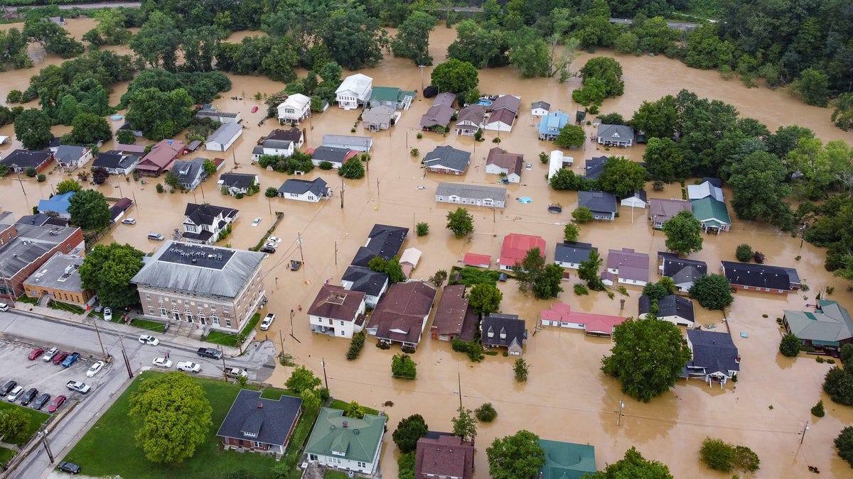An aerial view of homes submerged under flood waters from the North Fork of the Kentucky River in Jackson, Kentucky, on July 28, 2022.