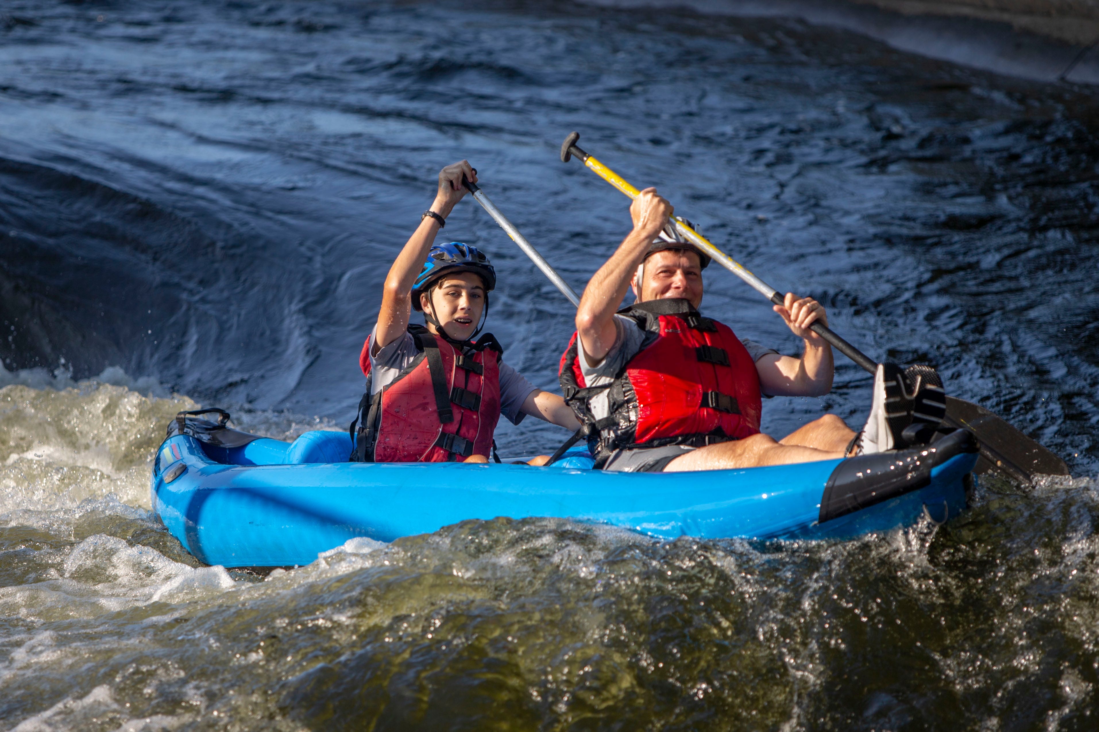 Peter Dolezal, 14, and his dad, Timothy, paddle down South Bend