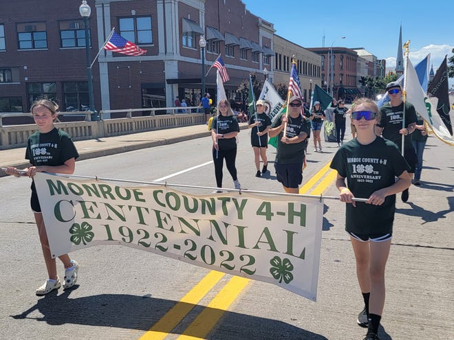 Members of Monroe County 4-H march in Sunday's Monroe County Fair Parade.