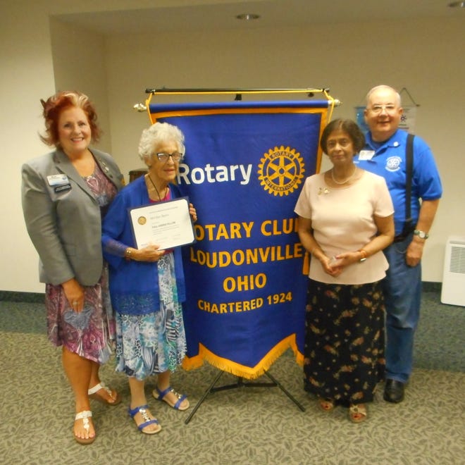 Mary Aufdenkampe, left, past Rotary district governor, and Brian Hartzell, right, president of the Loudonville Rotary, present Paul Harris Fellowship honors to Marilyn Byers (holding certificate) and Annie Kuttothara at a recent Rotary meeting.