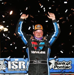 Four-time World of Outlaw National Champion Brandon Sheppard celebrates at Victory Lane after winning the Prairie Dirt Classic for the third time and taking home $103,000.