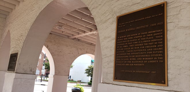 A plaque in the Market House that addresses some of its difficult history, shown on Monday, Aug. 1, 2022.