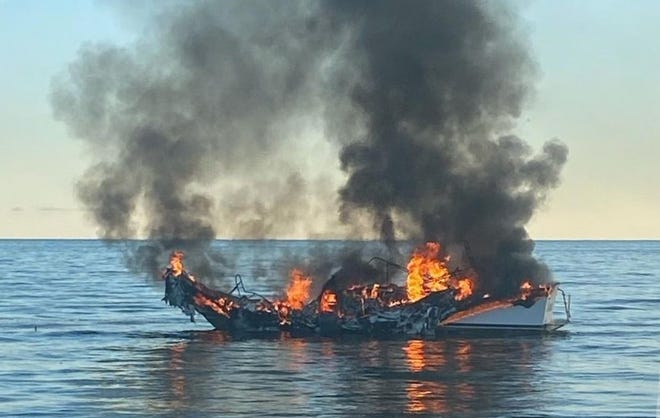 A 37-foot boat sank in Lake Huron after it caught fire.