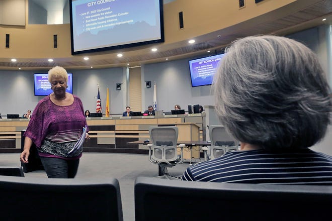 Rev. Carolyn Wilkins takes her seat after speaking in support of funding affordable housing at a City Council meeting on Aug. 1, 2022.