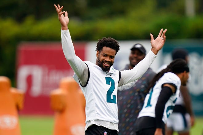Philadelphia Eagles' Darius Slay reacts to fans cheering during training camp at the NFL football team's practice facility, Friday, July 29, 2022, in Philadelphia. (AP Photo/Matt Slocum)