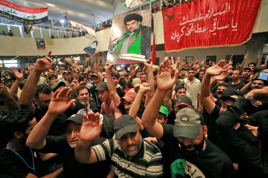 Supporters of Iraqi cleric Moqtada Sadr, take part in a mourning ritual amid the Shiite Ashura commemoration period as they occupy Iraq's parliament in the capital Baghdad's high-security Green Zone while protesting a rival political bloc's nomination for prime minister, on August 1, 2022. 