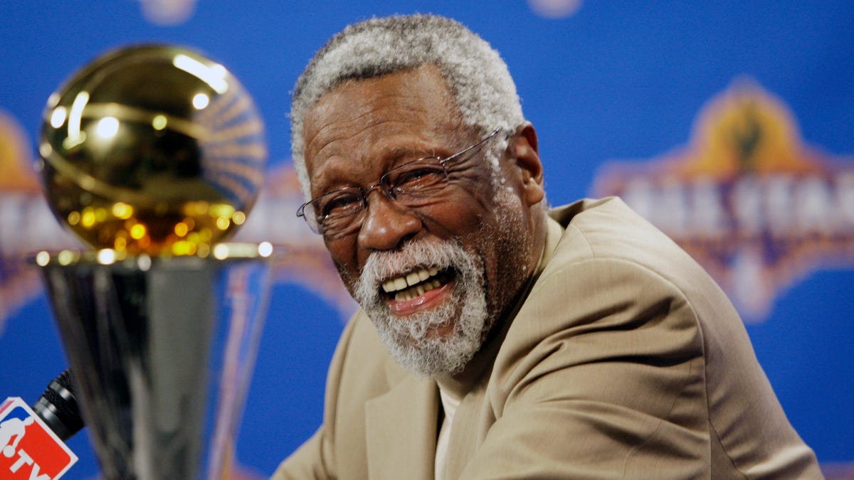 NBA great Bill Russell reacts at a news conference as he learns the most valuable player award for the NBA basketball championships has been renamed the Bill Russell NBA Finals Most Valuable Player Award, Feb. 14, 2009, in Phoenix.