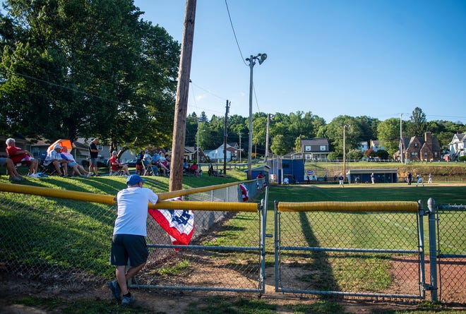 Evening shadows fall on fans watching the 71st annual Ellwood City Little League Tournament Classic at Freidoff Field in Ellwood City.