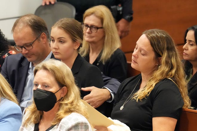 Ryan Petty embraces his daughter, Meghan Petty, as she and her mom, Kelly Petty, return to their seats after giving victim impact statements in the penalty phase of the trial of Marjory Stoneman Douglas High School shooter Nikolas Cruz at the Broward County Courthouse in Fort Lauderdale on Monday, August 1, 2022. The Petty’s younger daughter, Alaina, was killed in the 2018 shootings. Cruz previously plead guilty to all 17 counts of premeditated murder and 17 counts of attempted murder in the 2018 shootings.