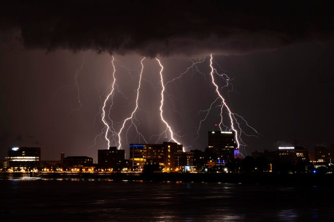 Lightning strikes over Downtown Evansville Monday evening, Aug. 1, 2022. A line of heavy thunderstorms brought damaging straight-line winds, heavy rain and hail to the area beginning at about 7 p.m. and continuing through the night.