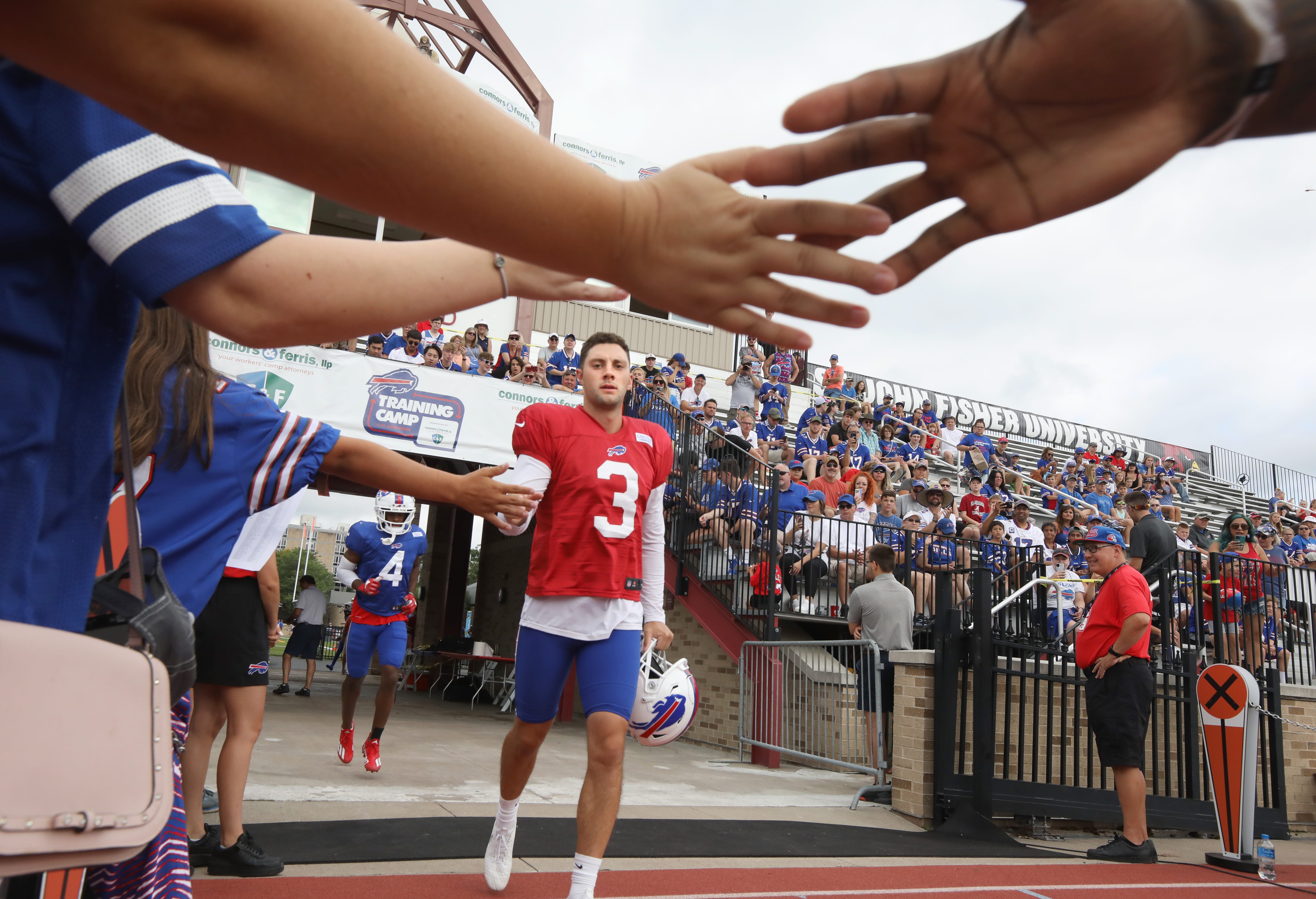 Bills punter Matt Haack high-fives fans as he takes the field for day eight of the Buffalo Bills training camp at St John Fisher University in Rochester Tuesday, August 2, 2022.