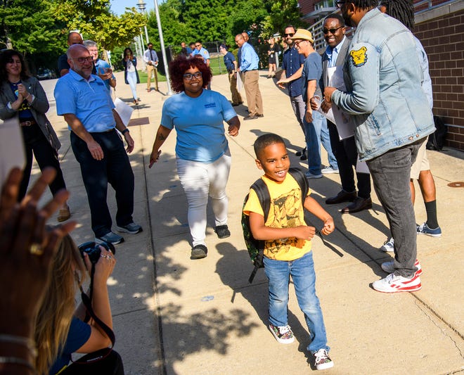 Community leaders welcome Orlando Le Bron to his first day of school at Fairview Elementary on Wednesday, Aug. 3, 2022. The annual event is put on by Commission on the Status of Black Males.