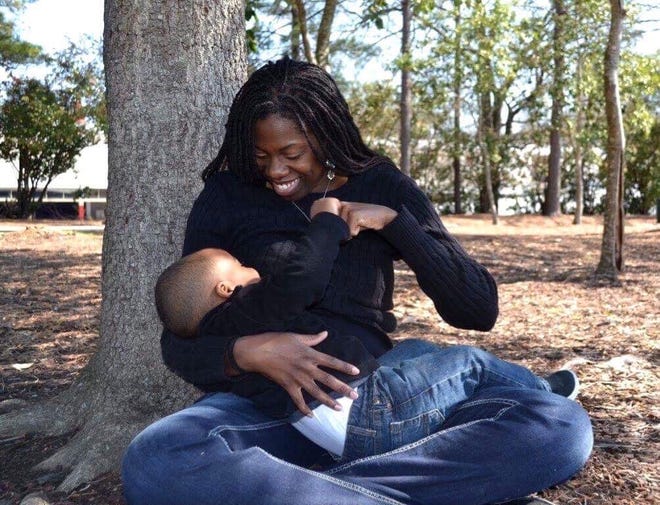 Amber Jones breastfeeds her son, Caleb.