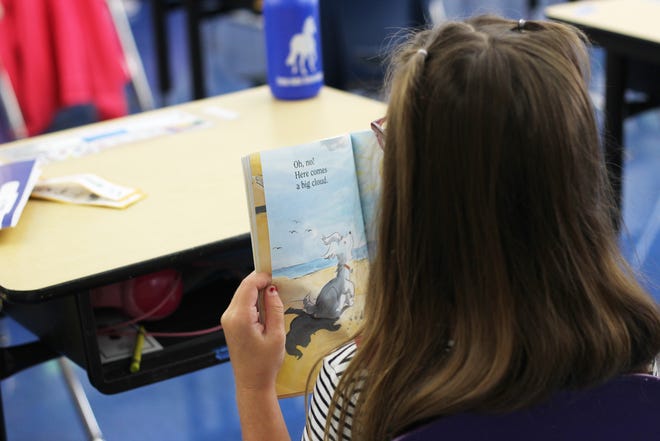 An incoming second grader reads in class Aug. 1 at the Summer Enrichment and Academic Learning Program at César E. Chávez Elementary School in Eugene.