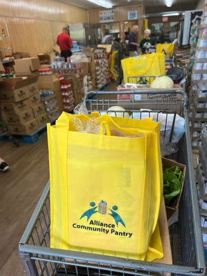 Clients of Alliance Community Pantry have been receiving sturdy cloth bags with their food for the past few weeks.