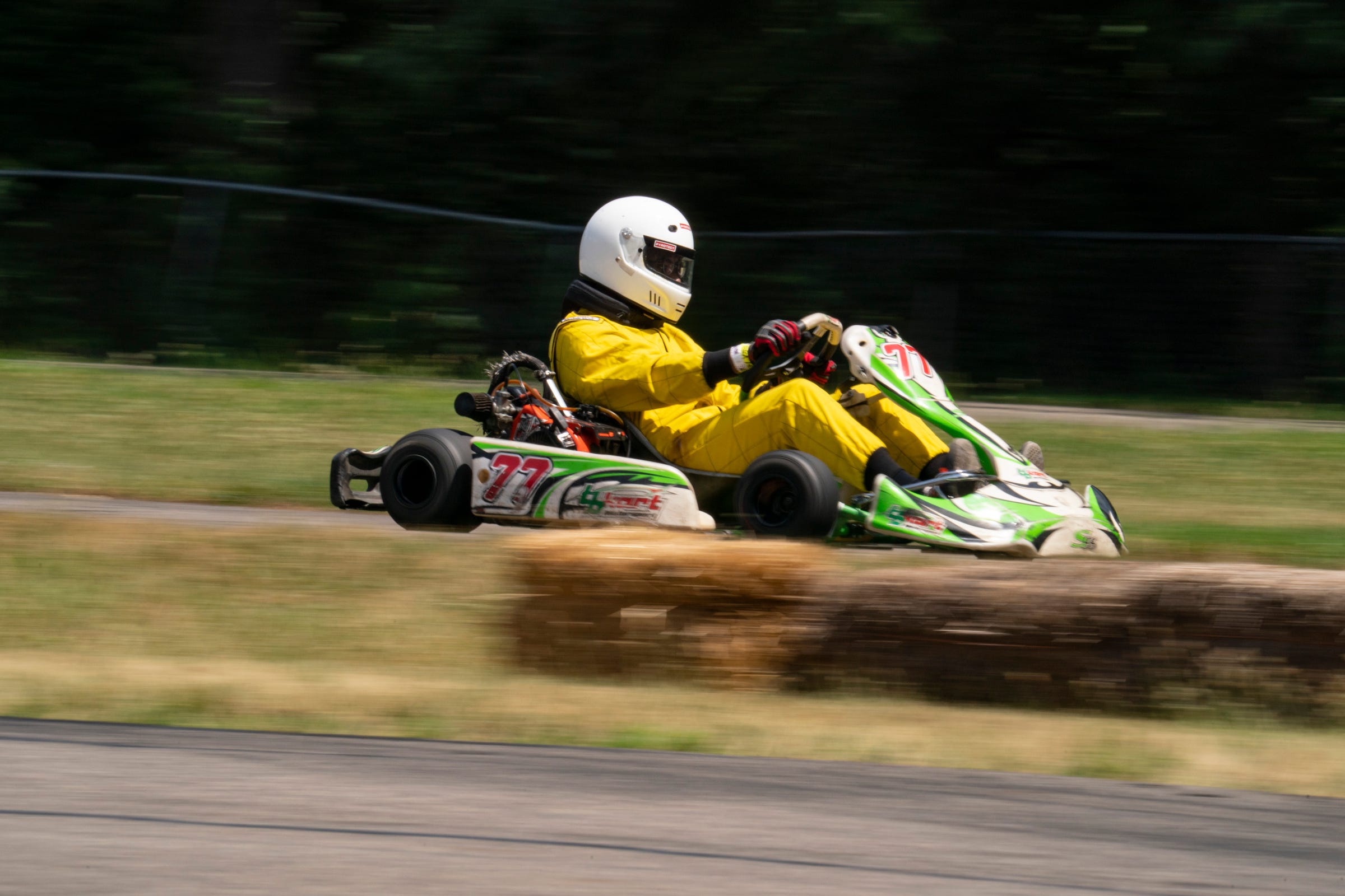 Detroit Student Race Team member Noah Christian, 17, of Detroit, does a practice run in one of the team's go-karts at the East Lansing Kart Track on Saturday, July 2, 2022.