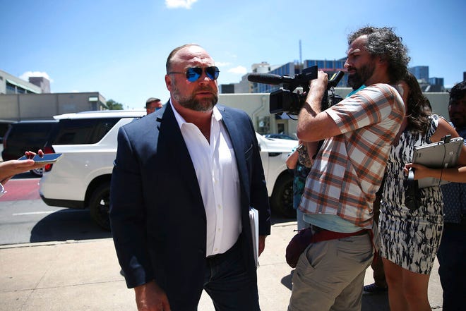 Alex Jones arrives at the Travis County Courthouse in Austin, Tuesday Aug. 2, 2022.