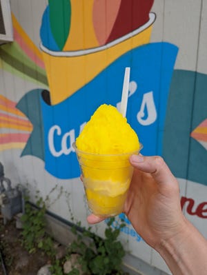 Doesn't a pineapple snowball with Dole pineapple soft serve squished in the middle sound so good?  We recommend a snowball after a day in the sun.