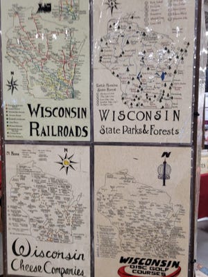 A booth in the expo hall at Wisconsin State Fair sells "medieval maps" with a Wisconsin theme.