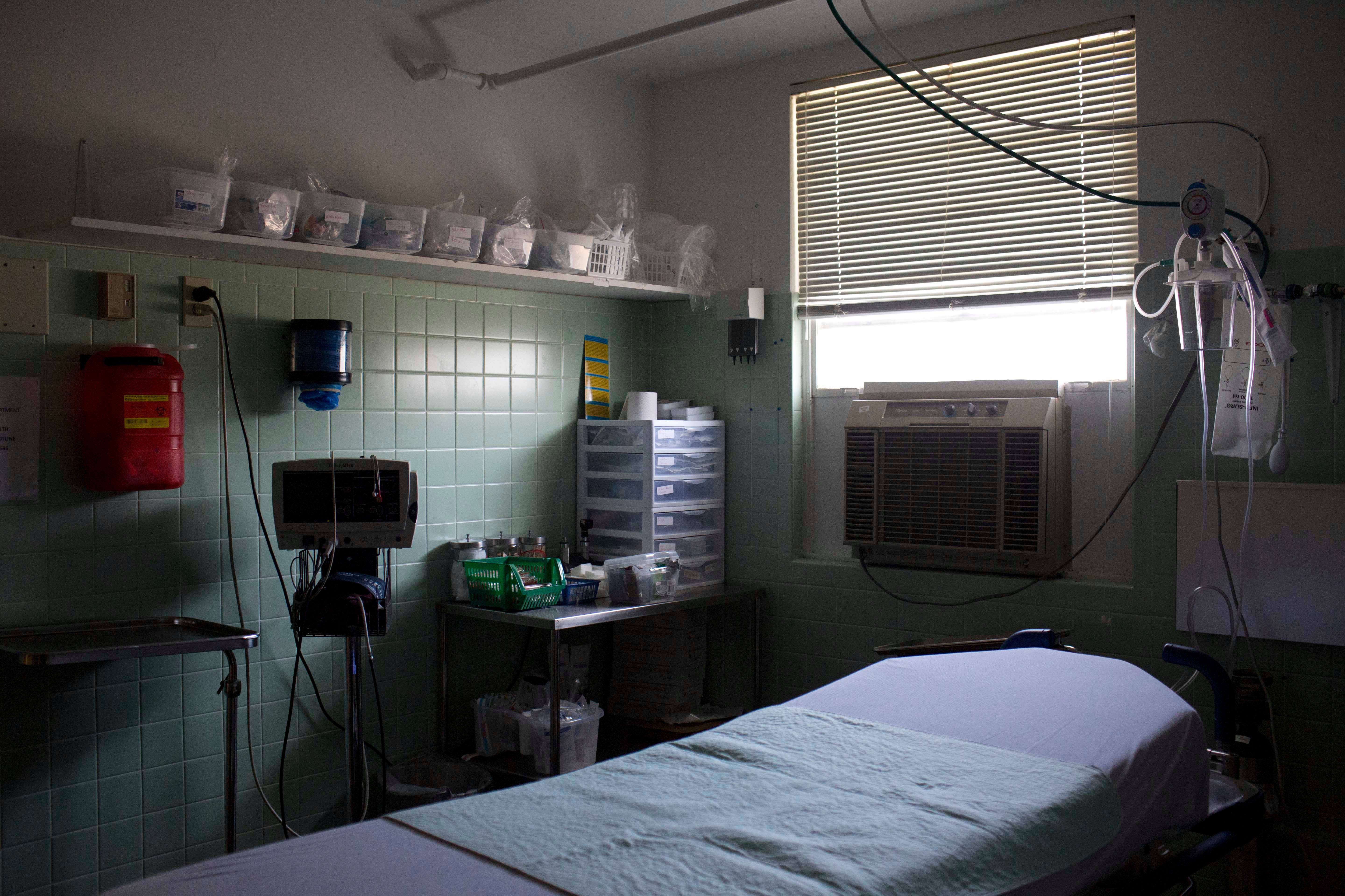 In this Thursday, July 30, 2015, photo, an exam room with a window air conditioning unit is shown at Wedowee Hospital, in Wedowee, Ala.