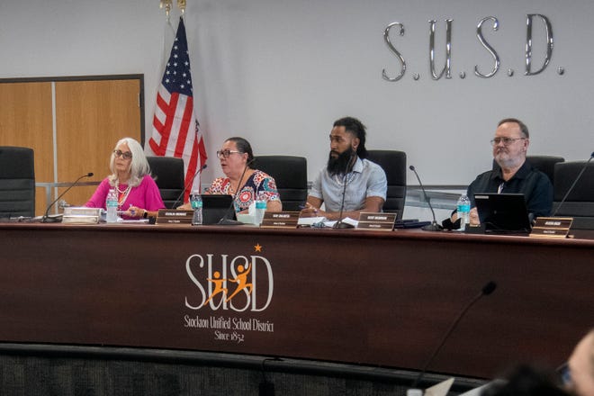 Stockton Unified School District interim superintendent Dr. Traci E Miller, left, board president Cecilia Mendez, board members Ray Zulueta and Scot McBrian attend a town hall meeting about the critical grand jury report at the SUSD headquarters in downtown Stockton.