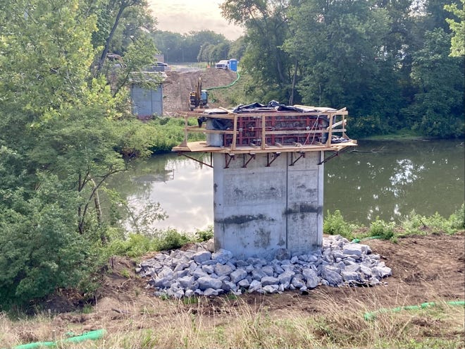 A pedestrian bridge is being constructed across Fall Creek as part of an extension of the Fall Creek Trail on Indianapolis' north side.