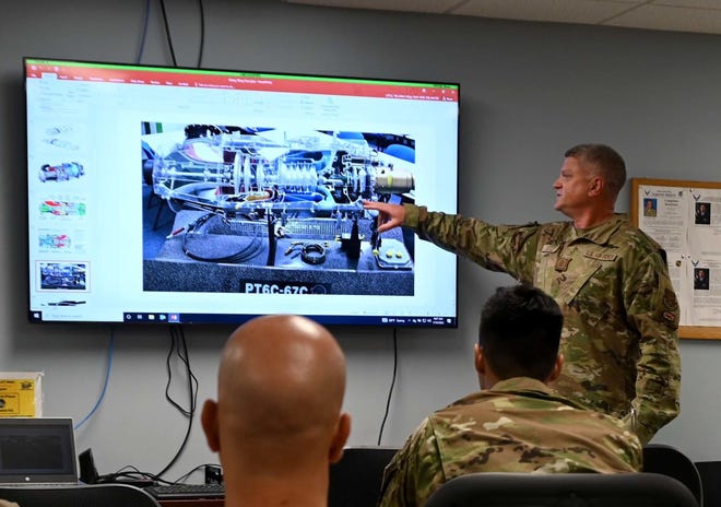 Master Sgt. William Little, 908th Airlift Wing flight safety noncommissioned officer in charge, gives a briefing on helicopter rotary system basics to members of the 908th Aircraft Maintenance Squadron July 10, 2022, at Maxwell Air Force Base, Alabama.