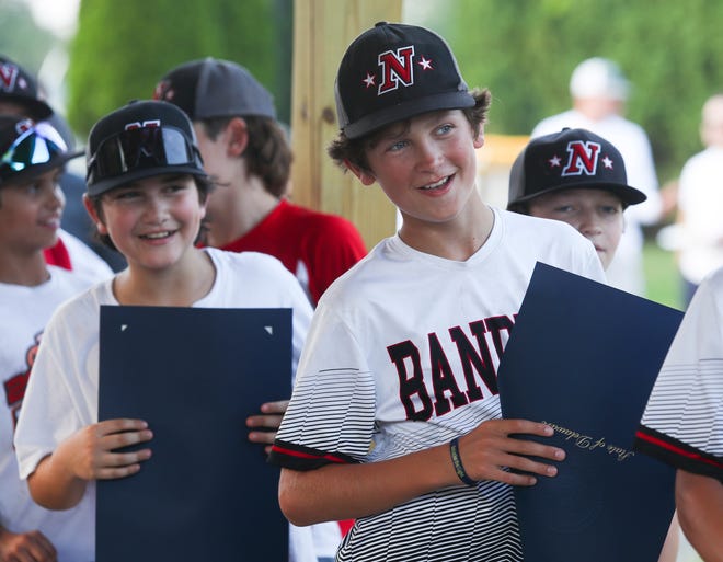 Naamans Little Leaguer Quinn Mulvena (front) watches as his teammates receive copies of proclamations honoring the state title winners during a send-off Thursday, August 4, 2022, before the team heads to the regional tournament in Bristol, Conn. to try to earn a trip to the Little League World Series.