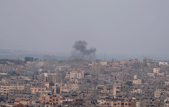 Smoke rises after Israeli airstrikes on a building in Gaza City on Friday, August 5, 2022.  Palestinian officials say Israeli airstrikes on Gaza have killed several people, including a senior militant, and wounded 40 others.