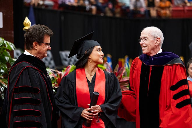 (left) Texas Tech President Lawrence Schovanec, and Erica Flores, general studies graduate from Dallas, speaking with Chancellor Emeritus Kent Hance.