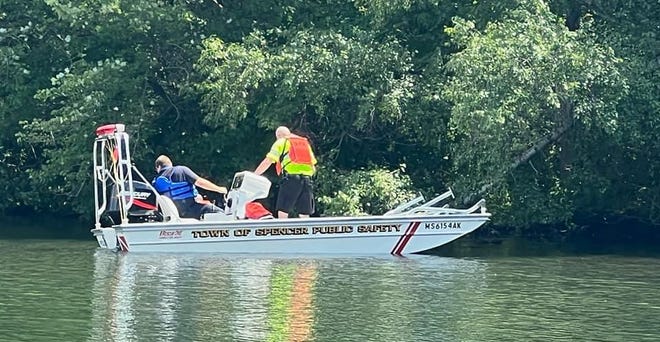 SPENCER - Public safety personnel work from a boat on Lake Whittemore at Luther Hill Park after the body of a missing woman was found in the water Saturday afternoon, August 6, 2022.