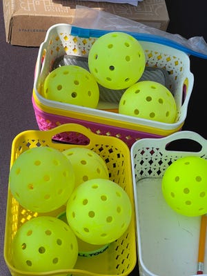 Baskets of balls ready to be used at the Boston Pickleball Classic on Aug. 6 at the Ridge Club in Acton.