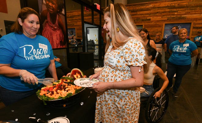 Angie Remsen serves refreshments to Amber Hayford during Saturday’s Community Baby Shower at Discover Life Church in Melbourne. Craig Bailey/FLORIDA TODAY via USA TODAY NETWORK