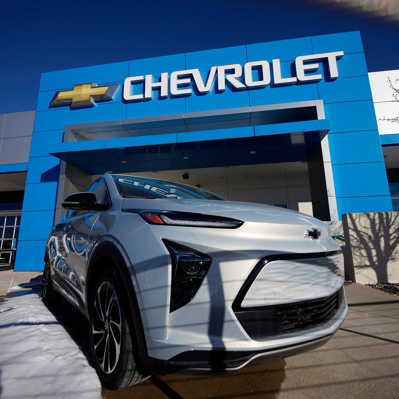 A lone, unsold 2022 Bolt electric vehicle sits on a lot at a Chevrolet dealership on Feb. 27, 2022, in Englewood, Colo.
