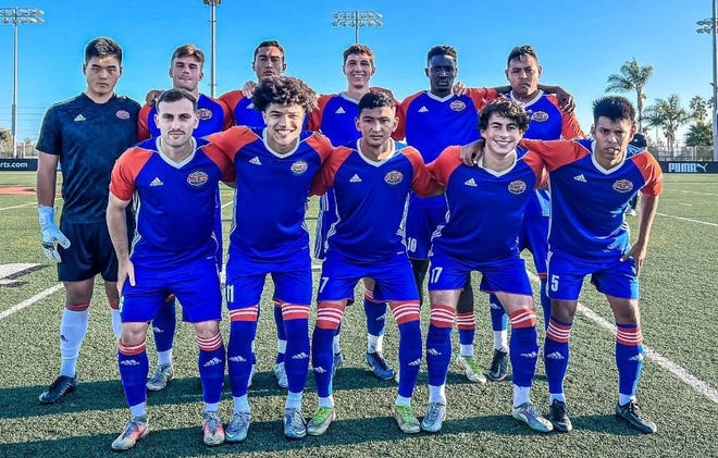 The Ventura County Fusion's starting lineup poses for a photo before the team defeated the Long Island Rough Riders 2-1 on Saturday night at Ventura College to capture the  USL League Two national title.